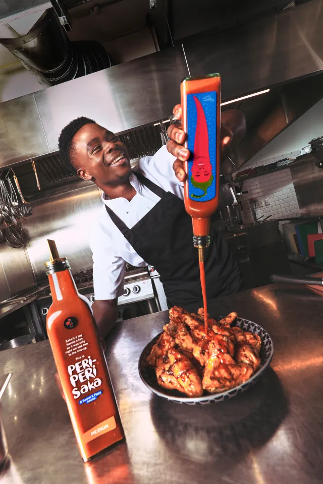 Bukayo Saka with Nando's sauce branding